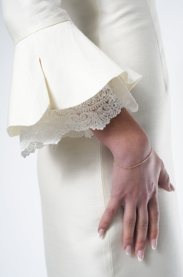 Cashmere‑wool and silk blend texture close‑up of NHÏJE Grace Ivory Midi Dress