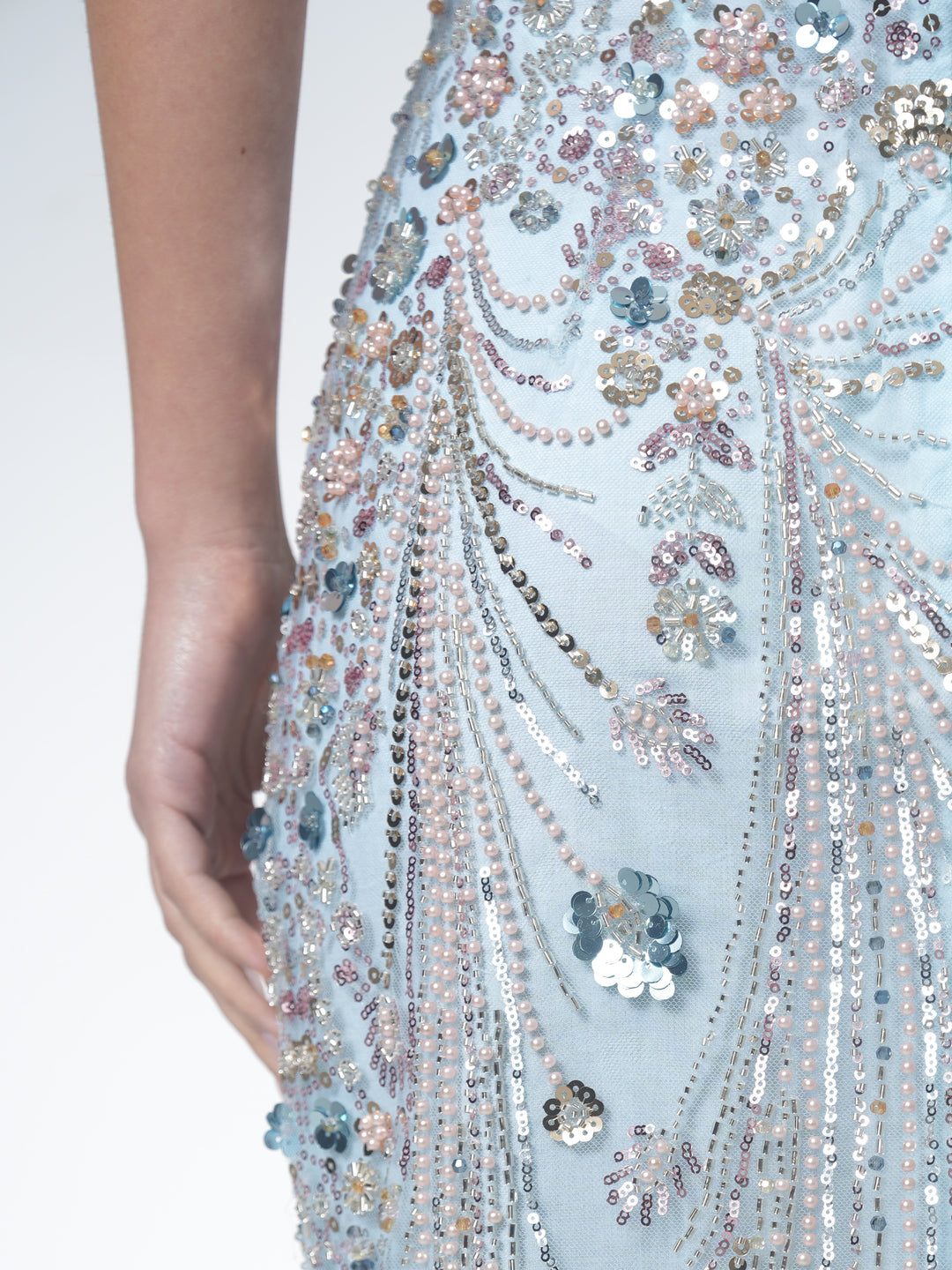 Model wearing NHÏJE Aqua Bloom Sequin Midi Skirt with ethereal aqua and silver sequin floral design