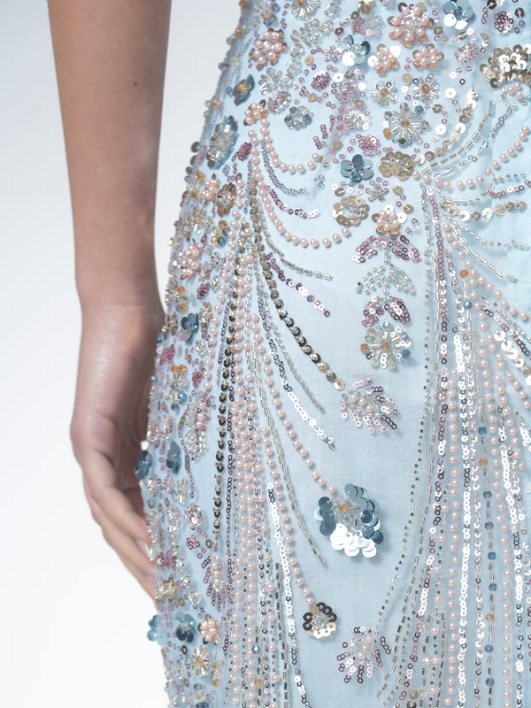Model wearing NHÏJE Aqua Bloom Sequin Midi Skirt with ethereal aqua and silver sequin floral design